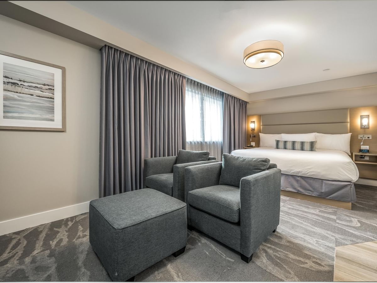 Sitting area and King Bed in our Coast Premium King Suite with Jetted Tub