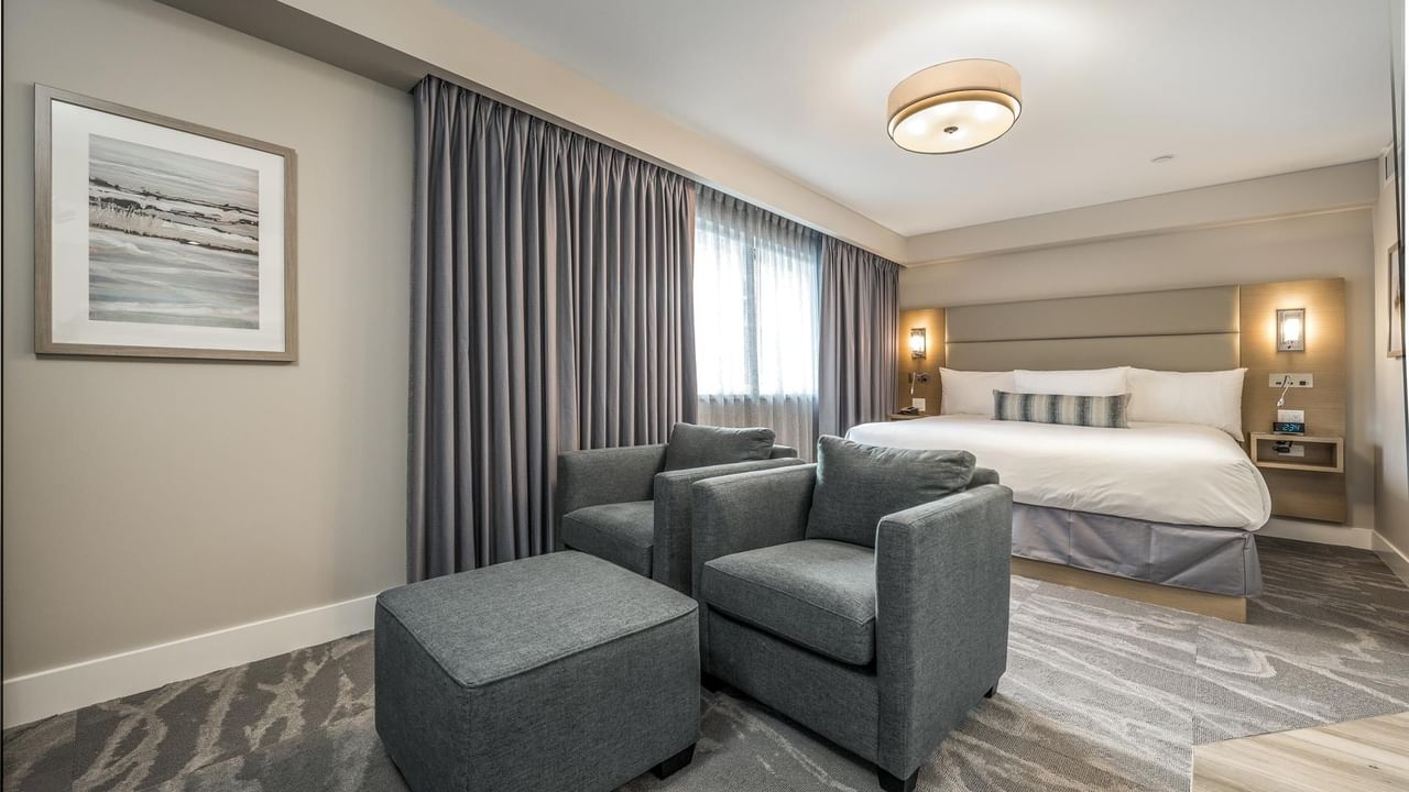 Sitting area and King Bed in our Coast Premium King Suite with Jetted Tub