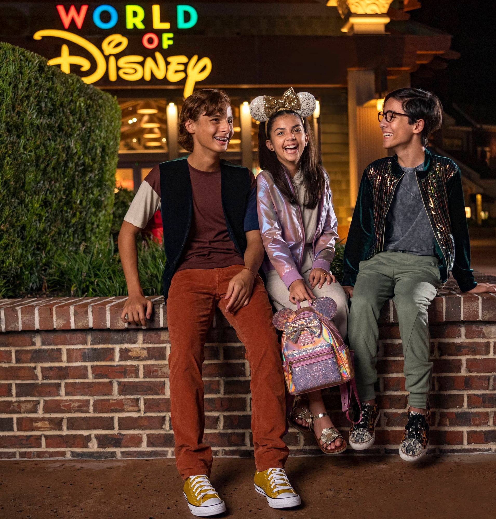 3 teens posing outside of World of Disney, Rosen Inn Universal