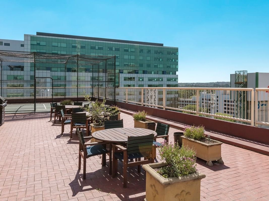 Outdoor dining area in the balcony area at Nesuto Canberra Apartment Hotel