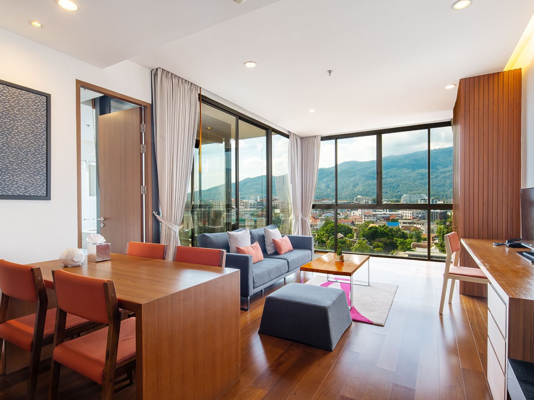 Living lounge of One Bedroom Suite with mountain view at Eastin Tan Hotel Chiang Mai