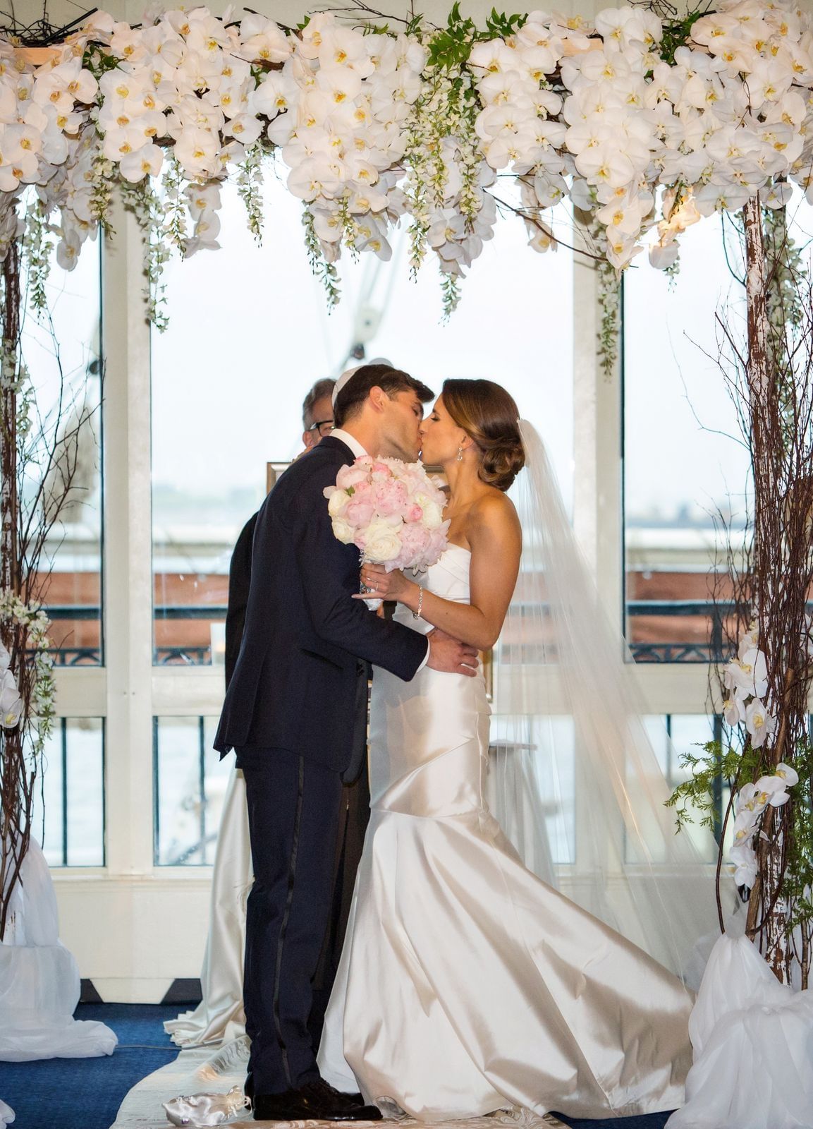 Newlyweds sharing their first kiss