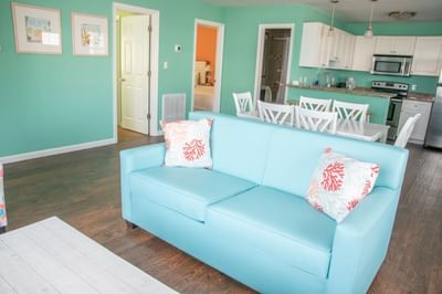 Living area leading to the kitchen and dining space in 3 Bedroom Apartment - 5 Queen Beds at South Beach Apartments