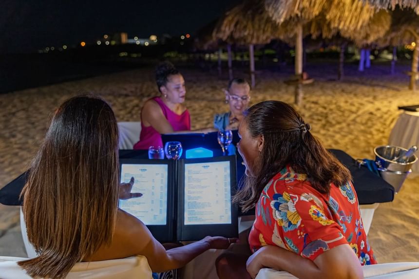 Two girls looking at the menu of Amsterdam Manor Resort