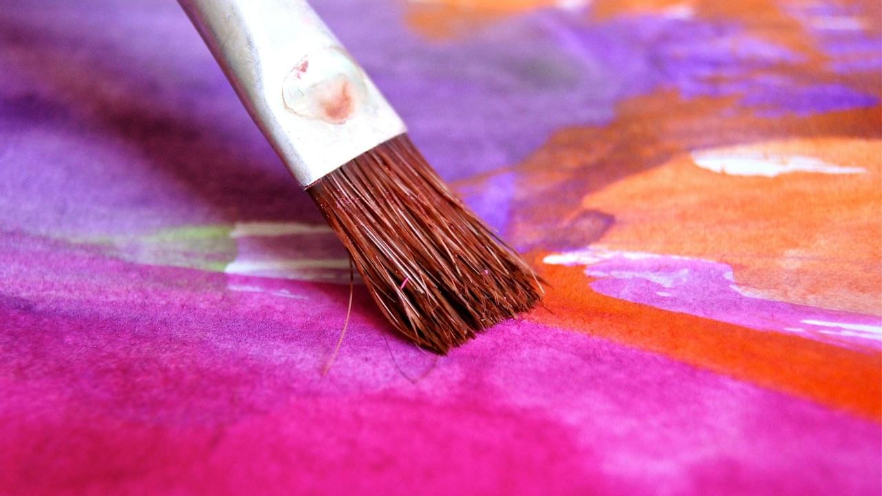 Paintbrush with purple and orange colors