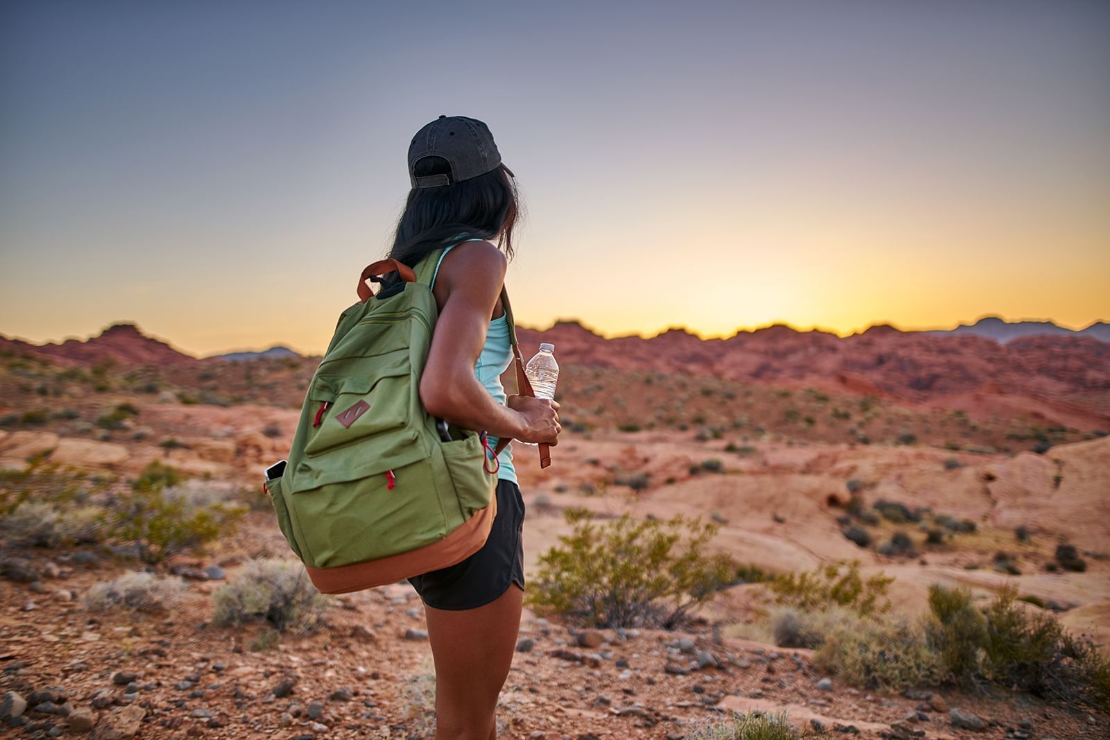 Woman backpacking in desert