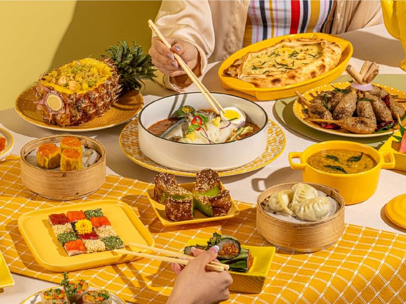Various dishes served on a table in the Pan-Asian Buffet at Sunway Resort
