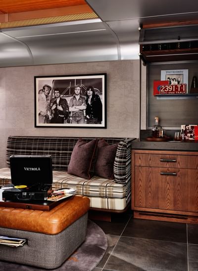 Backstage Trailer's lounge area featuring a couch & coffee table at The Verb Hotel