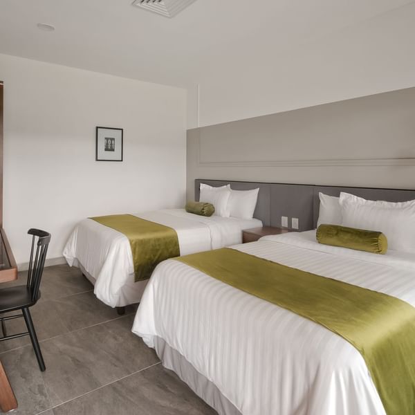 Superior Room interior with 2 beds at Gamma Hotels