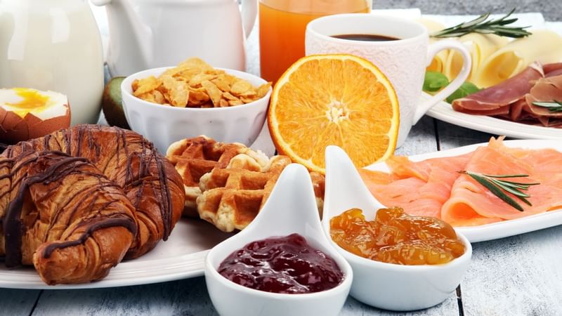Breakfast meal with fruits & drinks at The Originals Hotels