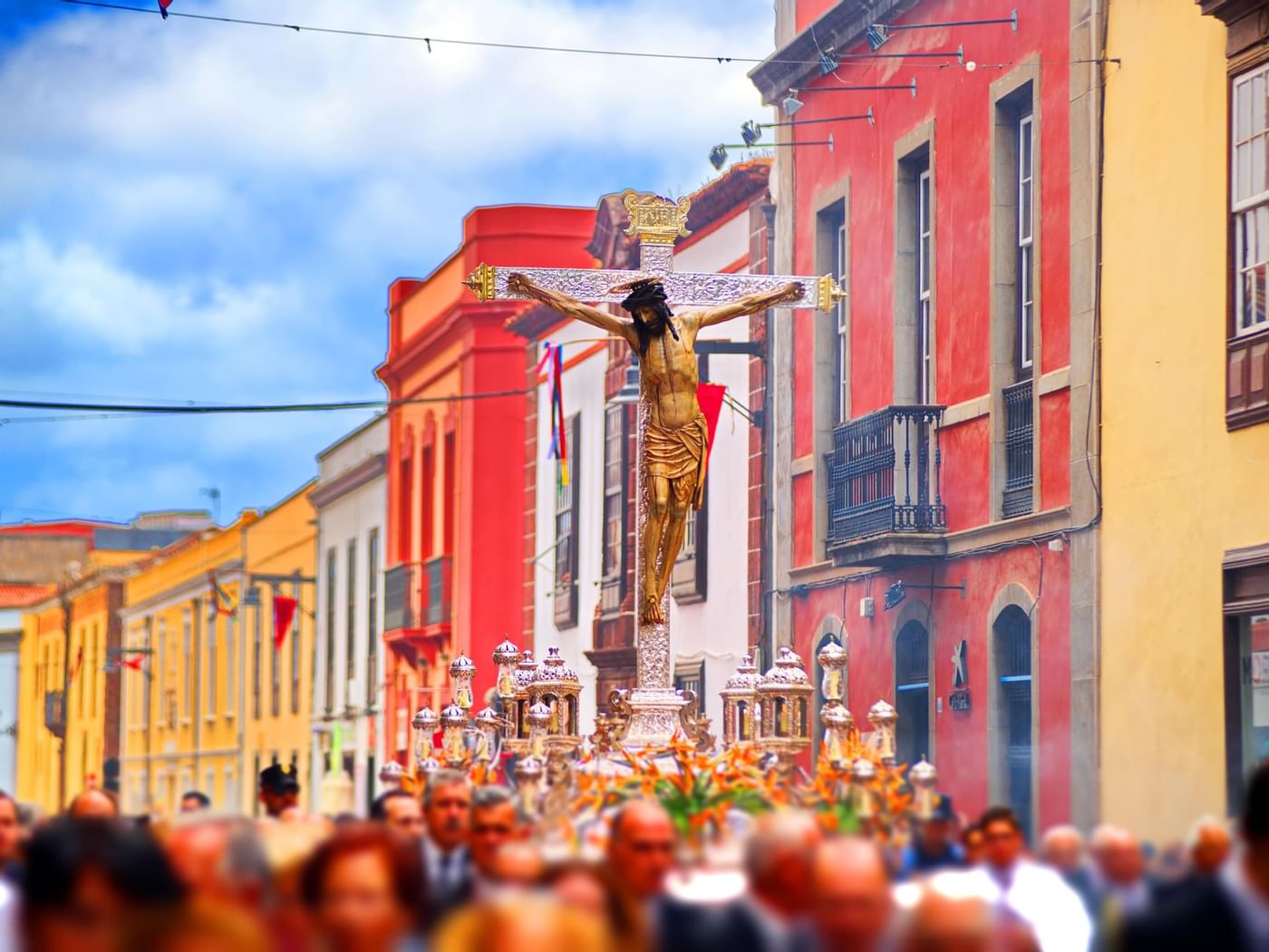 Carrying a cross in a procession near Grand Fiesta Americana