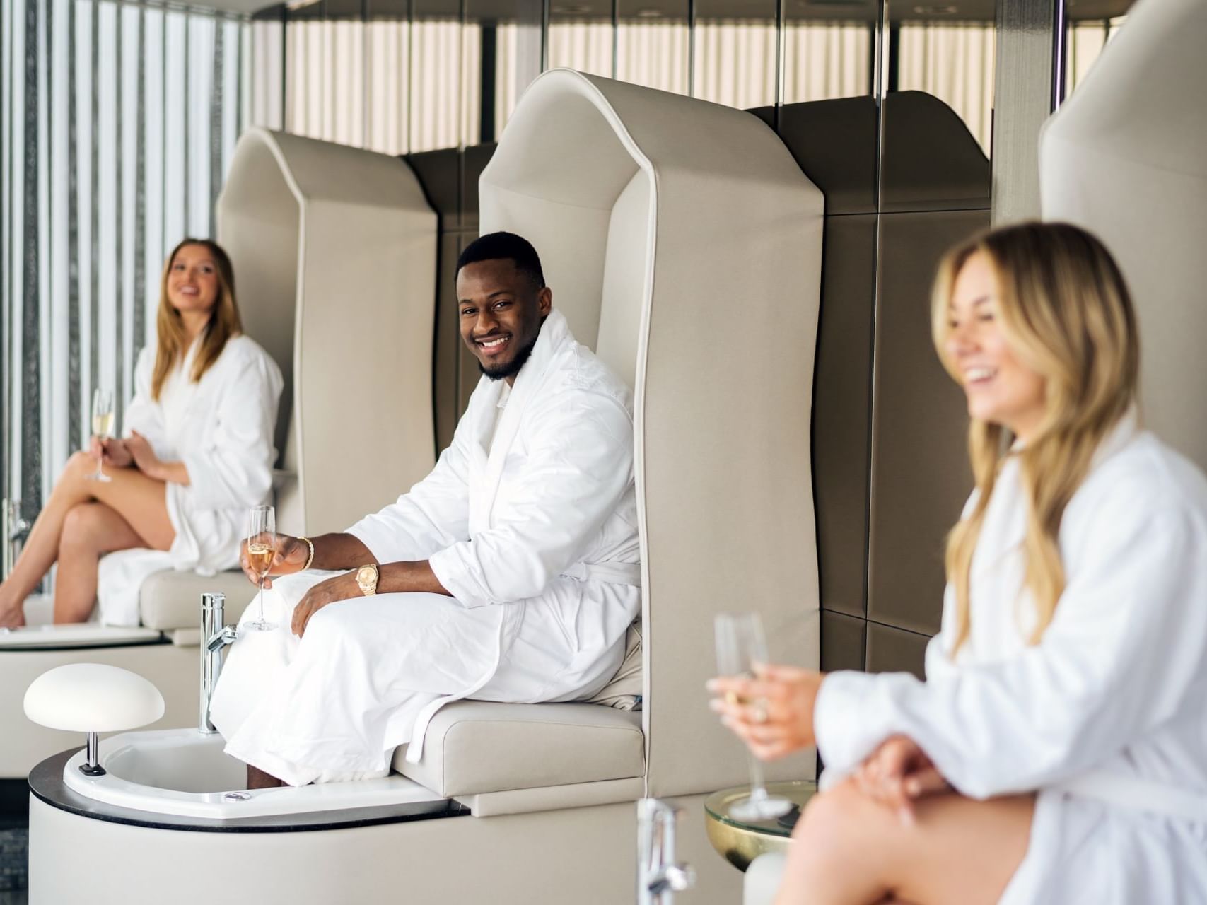 Three people enjoying the Nail Lounge