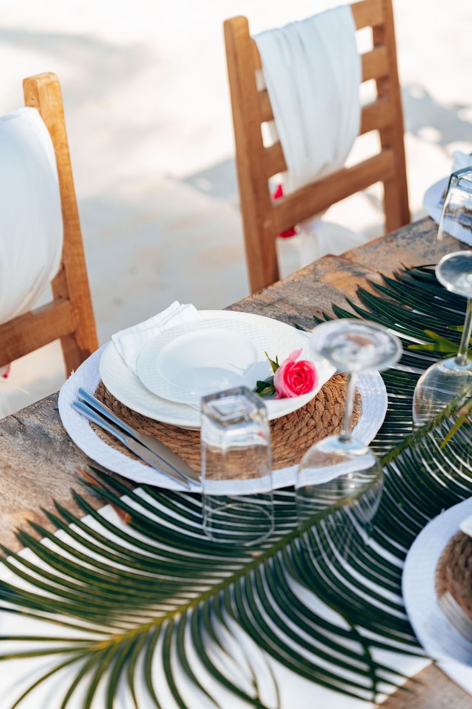 Plate with rose on table at SafiraBlu Luxury Resort & Villas