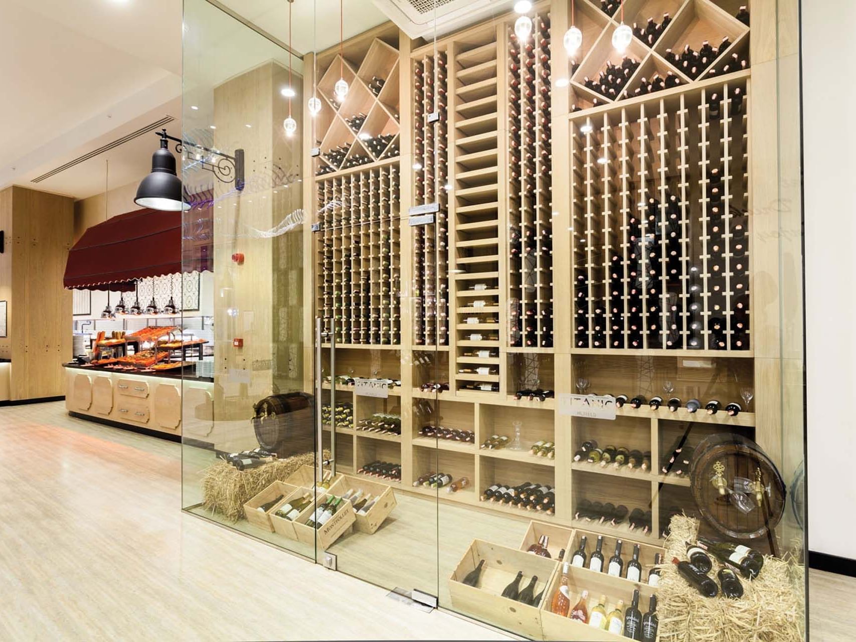 Wine bottles assorted on a wine shell counter in Parkfora Main Restaurant at Titanic Deluxe Lara