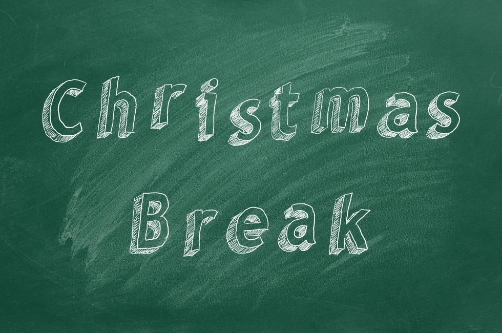 Twixmas Meaning Explained featuring a blackboard with Christmas Break written on it in white chalk