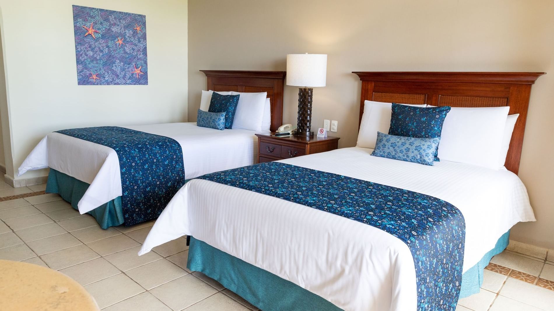 Twin double beds of Deluxe Double Garden View at Mundo Imperial