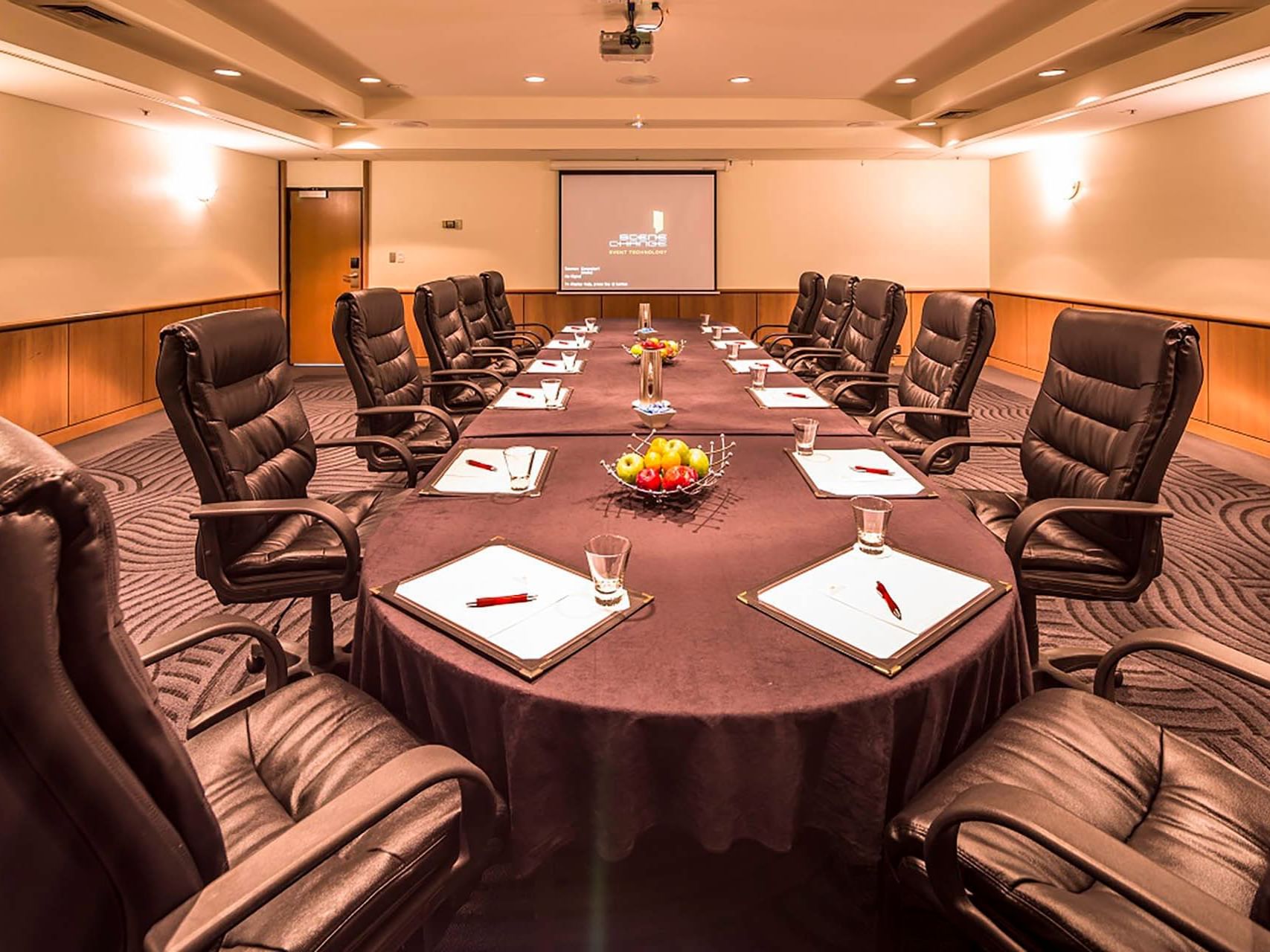 Conference table set-up & screen in Chancellor 4 at Grand Chancellor Hobart