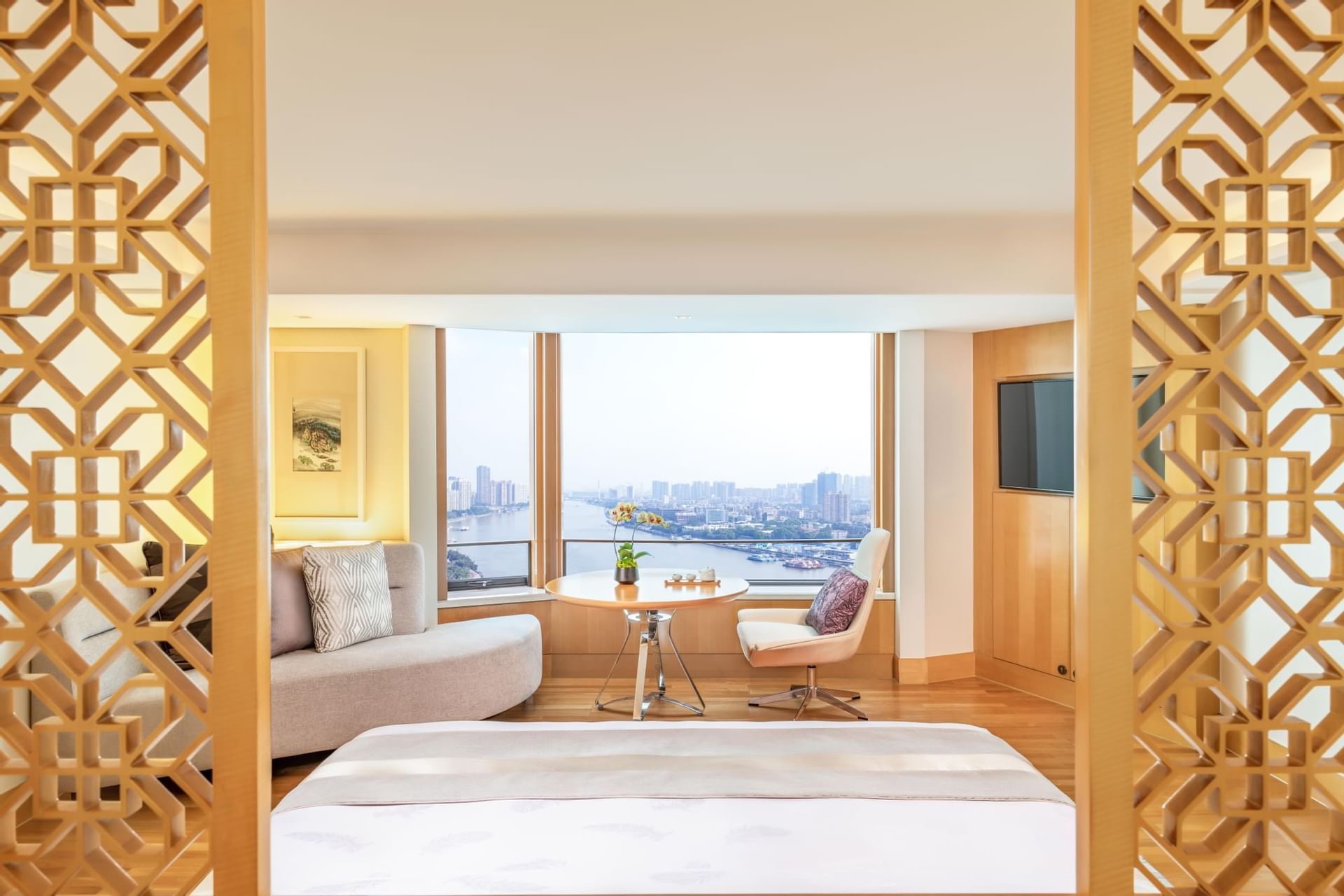 Bedroom interior with city view at White Swan Hotel
