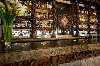 Bar counter & lounge area in The Hotel Playa Los Arcos