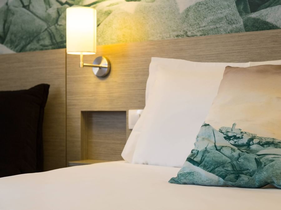 Closeup of Bedroom with pillows at Hotel Au Chene Vert