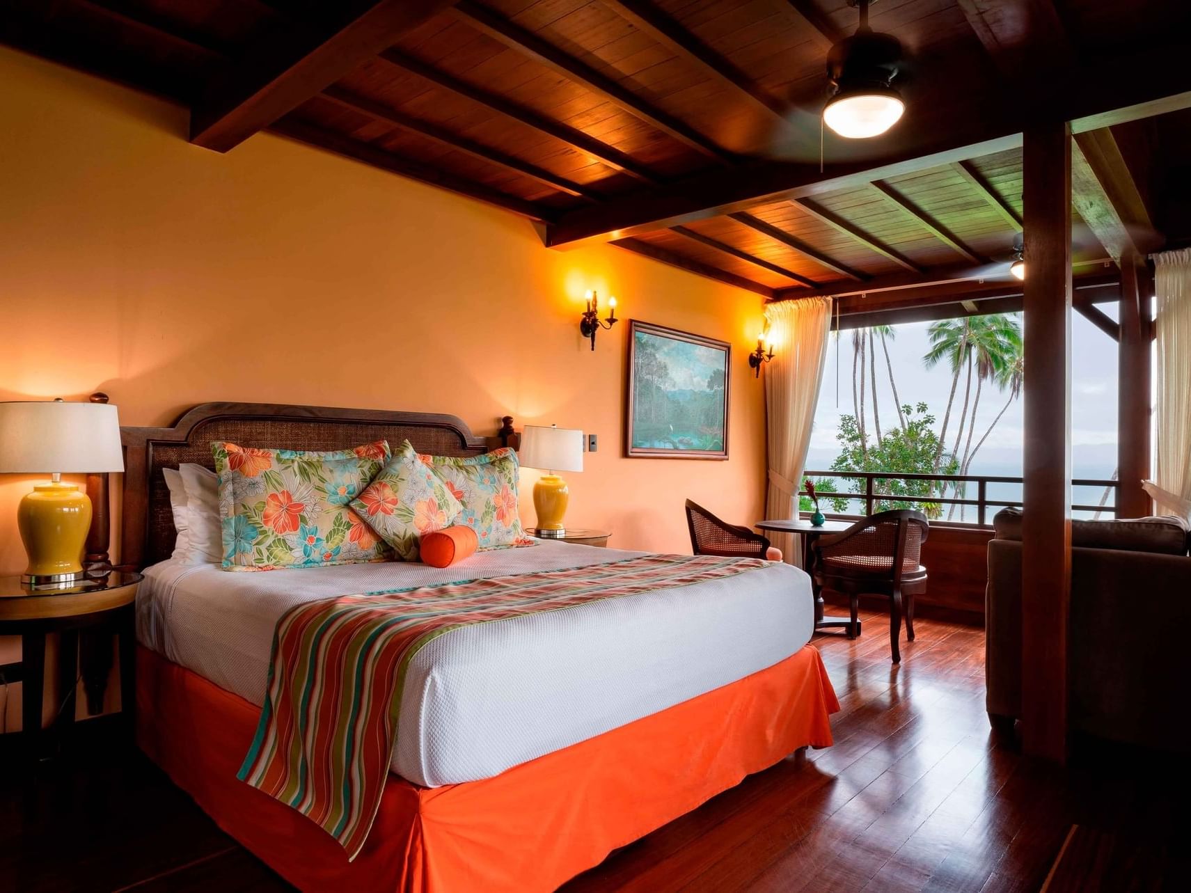 King bed in Deluxe Panoramic Ocean View at Playa Cativo Lodge
