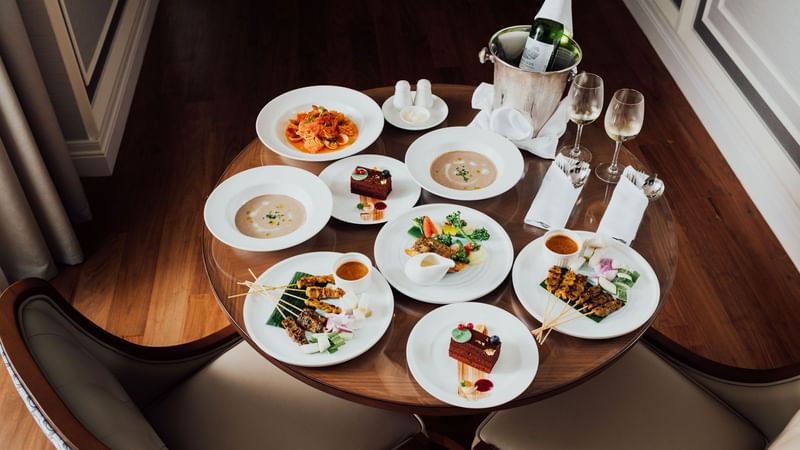 Meals & champagne served on a table at Fullerton Group