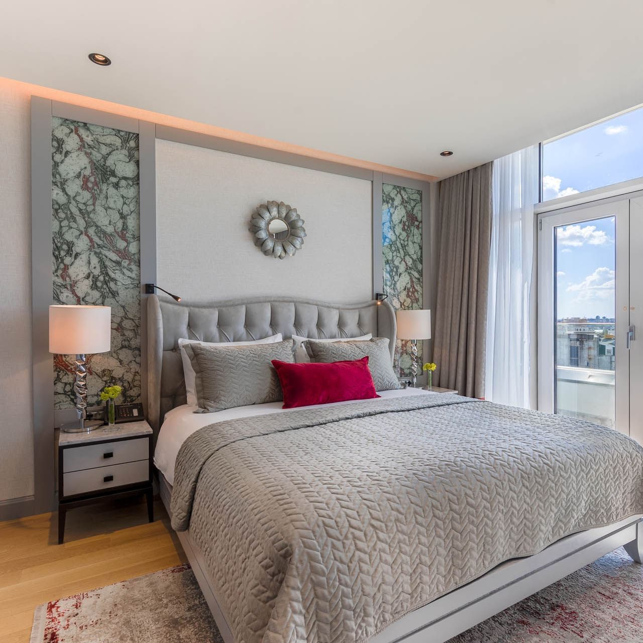 King bed and bedside lamps in Taksim Terrace Suite at CVK Taksim Hotel Istanbul