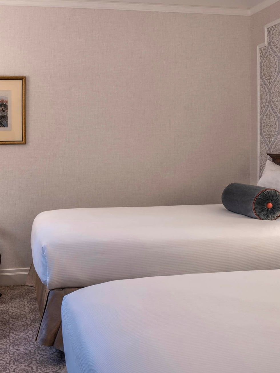 Suite of the Stars with two beds and chairs under artwork at Warwick New York