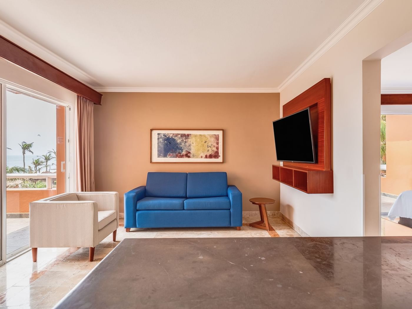 Living area with TV in Junior Suite at Grand Fiesta Americana