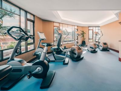 A well-equipped gym with exercise machines at Paradox Singapore