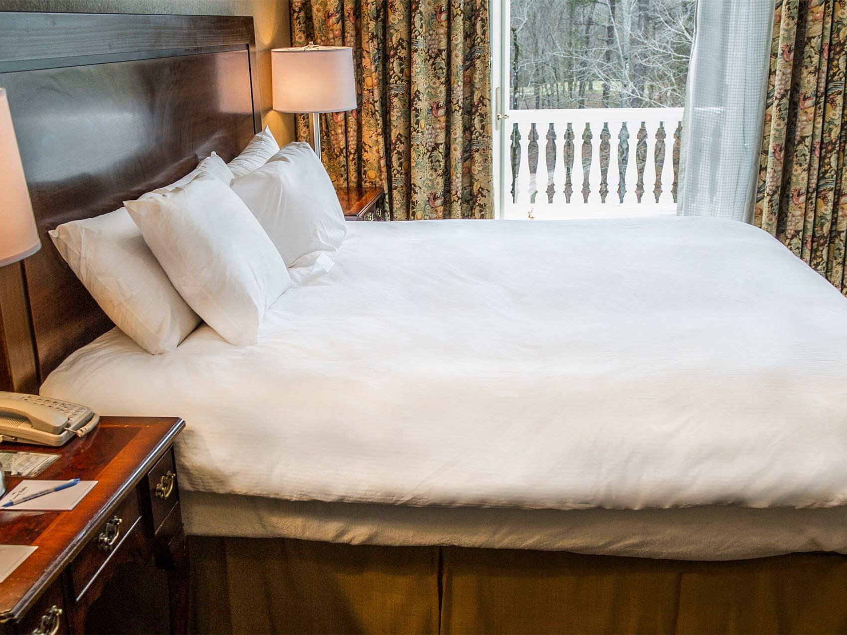 Fairway House bed room with window view at Pearl River Resorts