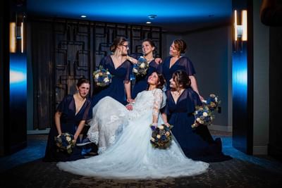 bride surrounded by bridesmaids 