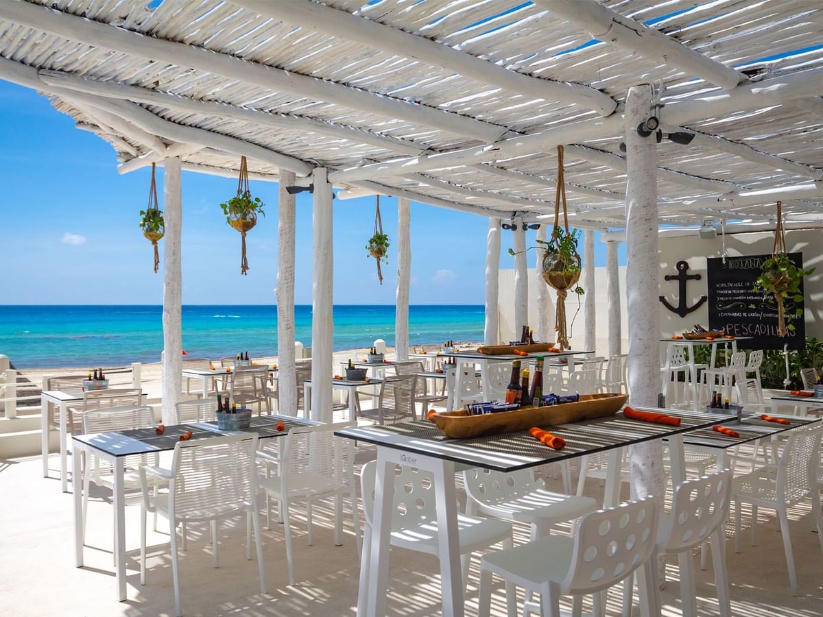 `Well-arranged restaurant by the beach at Fiesta Americana