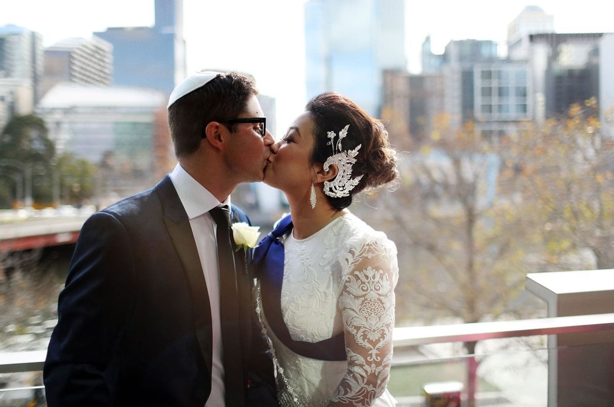 Couple kissing in the terrace at Crown Hotel Melbourne