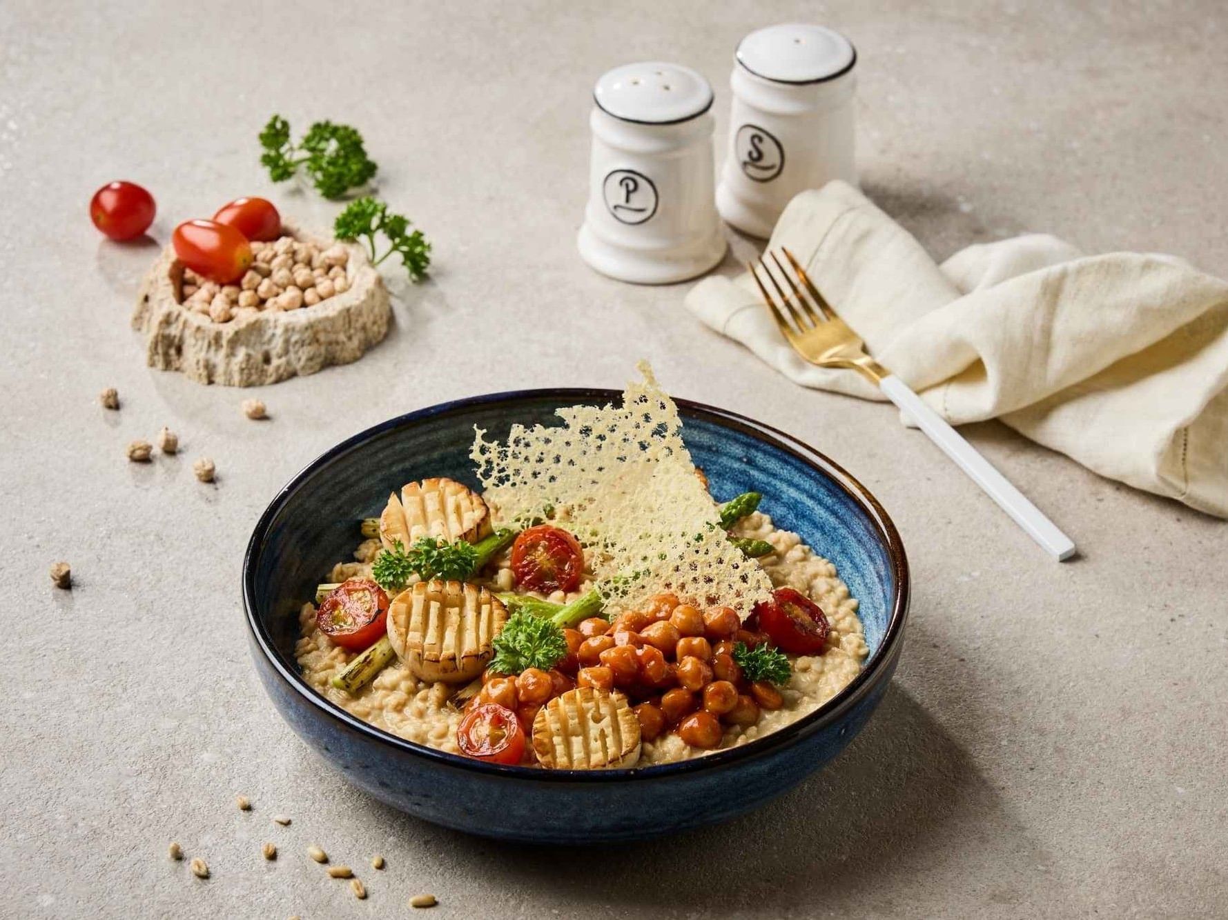 The Local Table, a luxury restaurant in Bangkok at Paradox Bangkok Sukhumvit, featuring Oat groats risotto