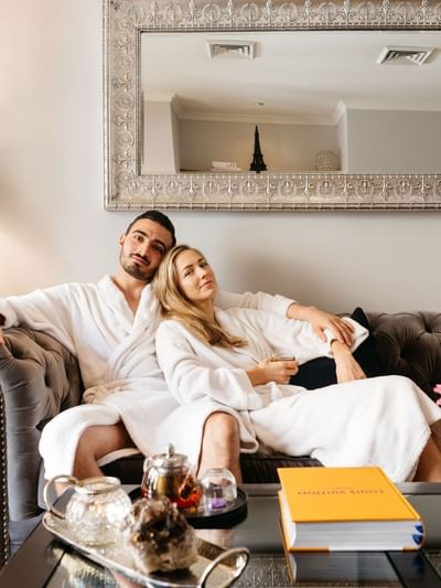 Couple relaxing on a sofa at Stephanies Luxury Spa near Sofitel Brisbane Central