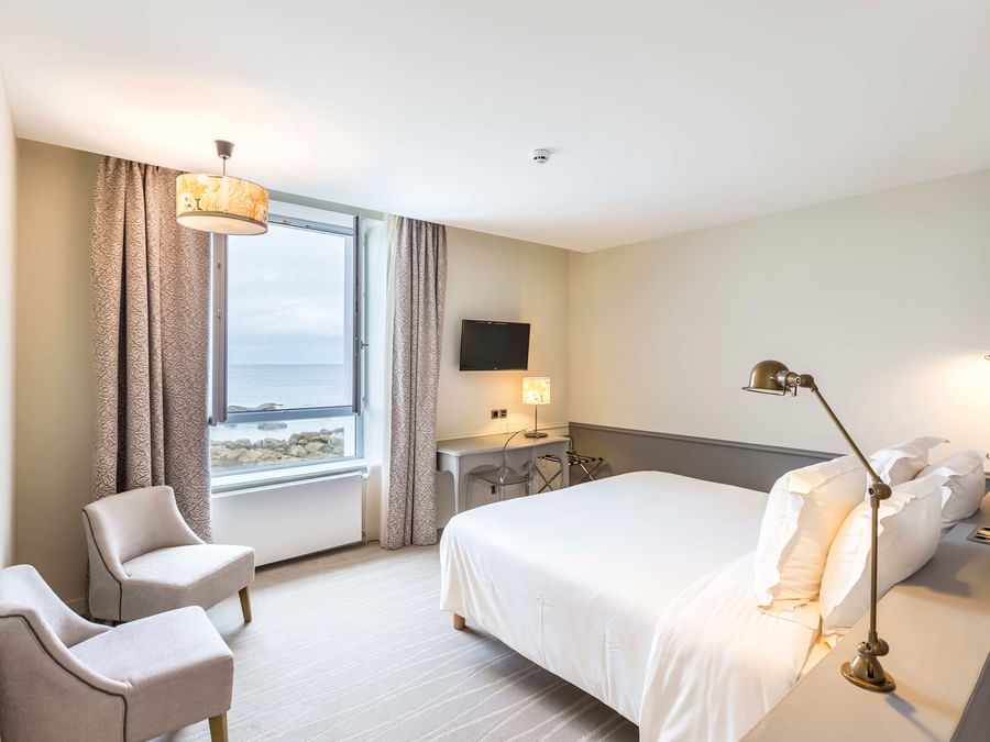 Clubroom bedroom with sea views at The Originals Hotels
