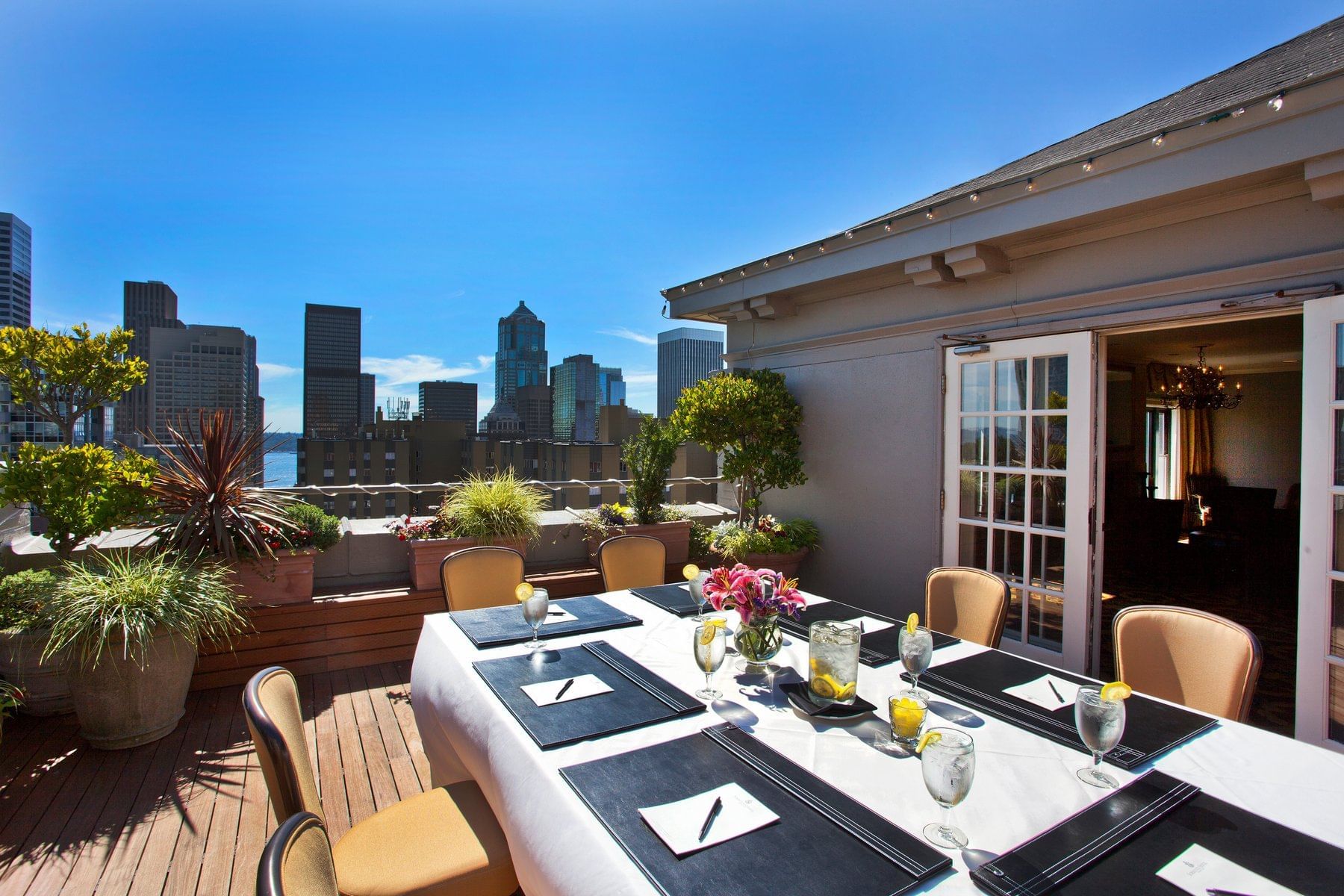 Outdoor dining table setup in the Penthouse at Hotel Sorrento