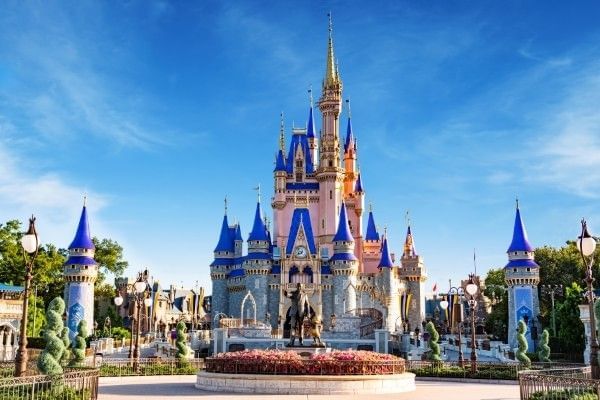 Cinderella Castle in Magic Kingdom on a beautiful clear day, a great place to propose at Walt Disney World.