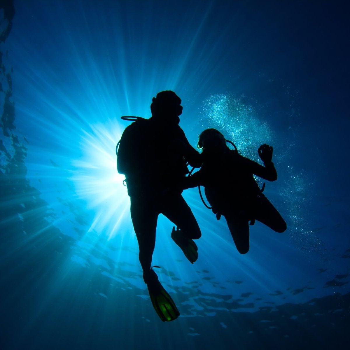 couple scuba diving in ocean