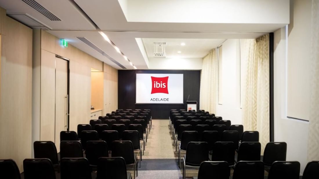 Theater-style setup facing a large screen in The Think Tank at Ibis Adelaide