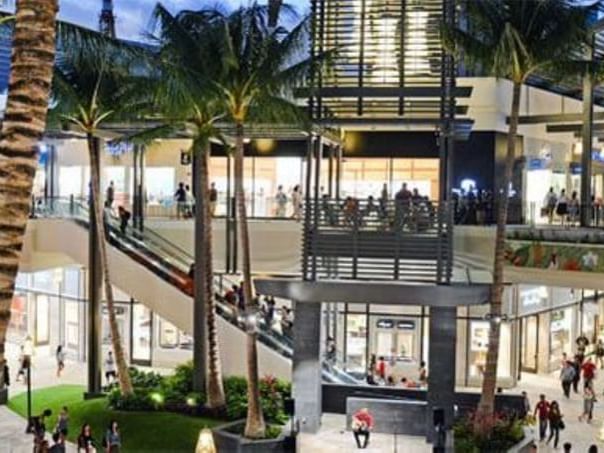 People leisuring in the Ala Moana Center near Paradise Bay Resort