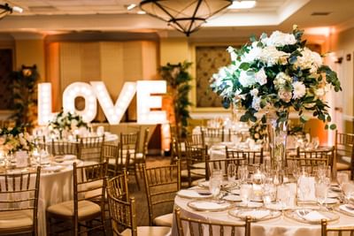 wedding decorations with flowers and sign that says l-o-v-e