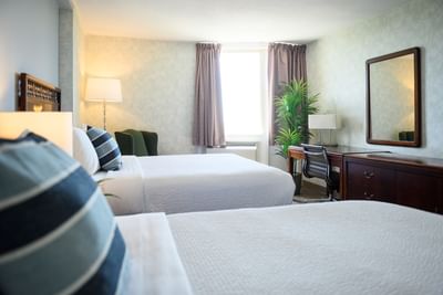 Workspace, potted plant, and lounge chair by the cozy bed in Standard Room Two Double at Rodd Grand Yarmouth