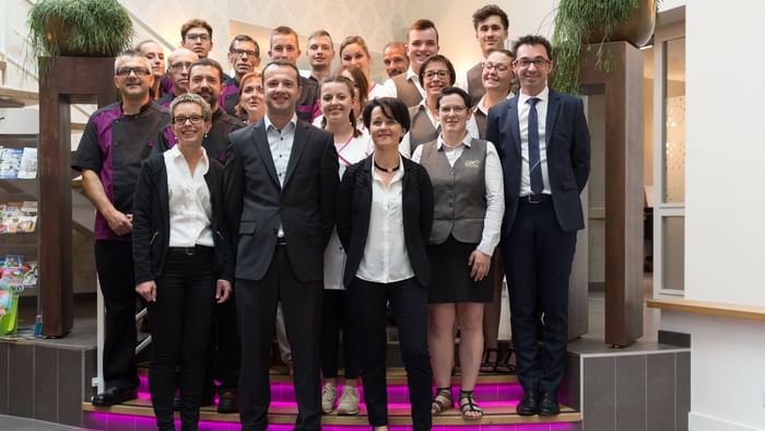 An image of team members at Hotel Le Lion d'Or