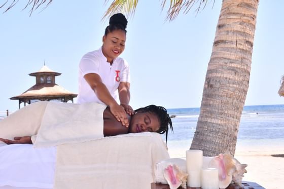 Lady receiving a massage in the outdoor Spa at Holiday Inn Montego Bay