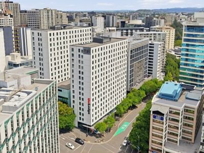 Mayoral Drive Student Accommodation in a bustling urban skyline with modern architecture and busy streets.
