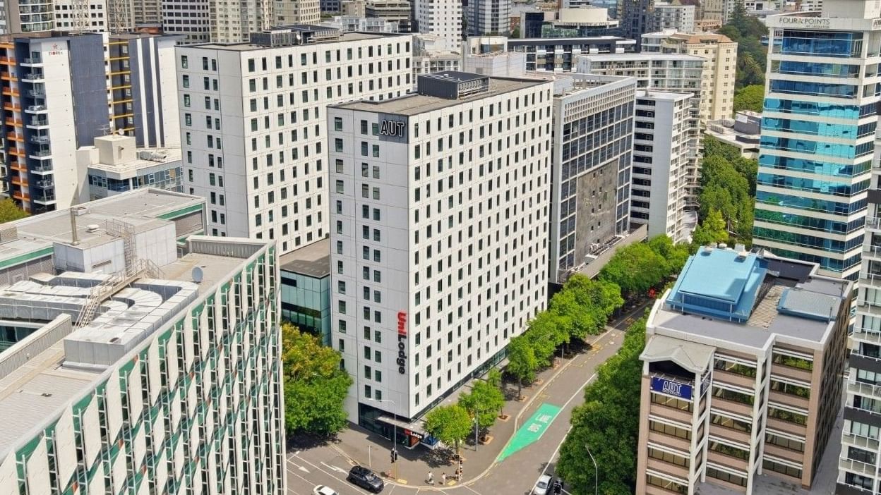 Mayoral Drive Student Accommodation in a bustling urban skyline with modern architecture and busy streets.