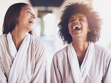 Two ladies smiling in luxurious spa at Bridgewood Manor Hotel