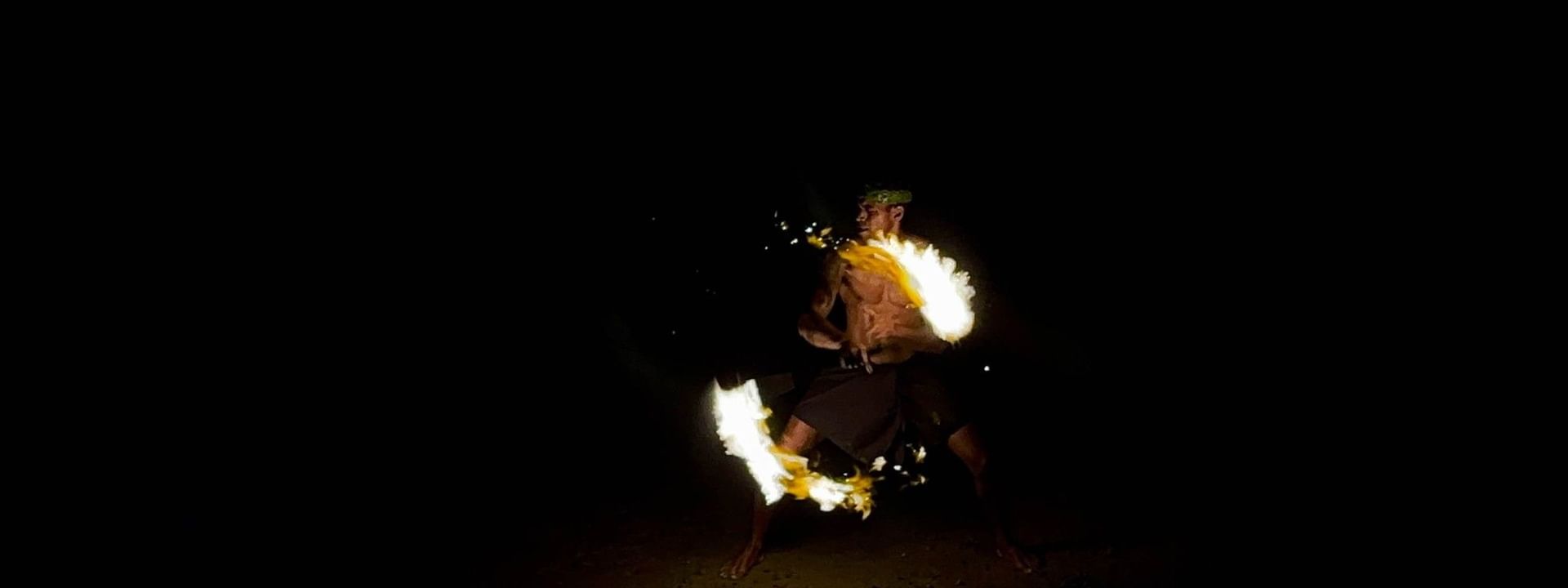 Man performing a traditional fire dance at The Naviti Resort, Korolevu